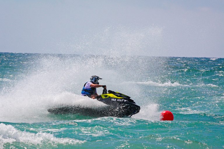 popovka-ukraine-august-2012-jet-ski-young-man-jet-ski-professional-jet-ski-rider-jet-ski-championship-jetski-performs-many-tricks-waves-min
